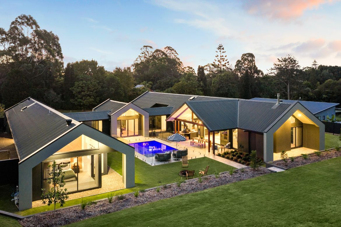 Aerial view of Prize Home 468, showcasing the pavilion-style design, central pool, landscaped grounds and luxury outdoor living areas