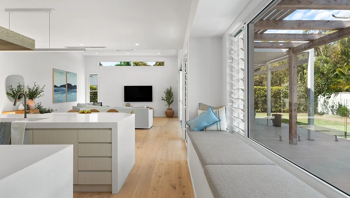The pool courtyard and timber pergola connecting the indoor and outdoor spaces of the Coolum Beach Prize Home.