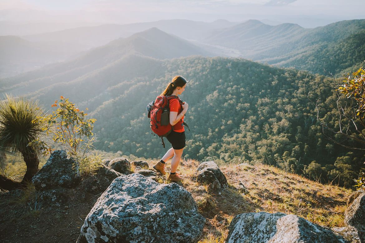 Person hiking across a trail in The Scenic Rim