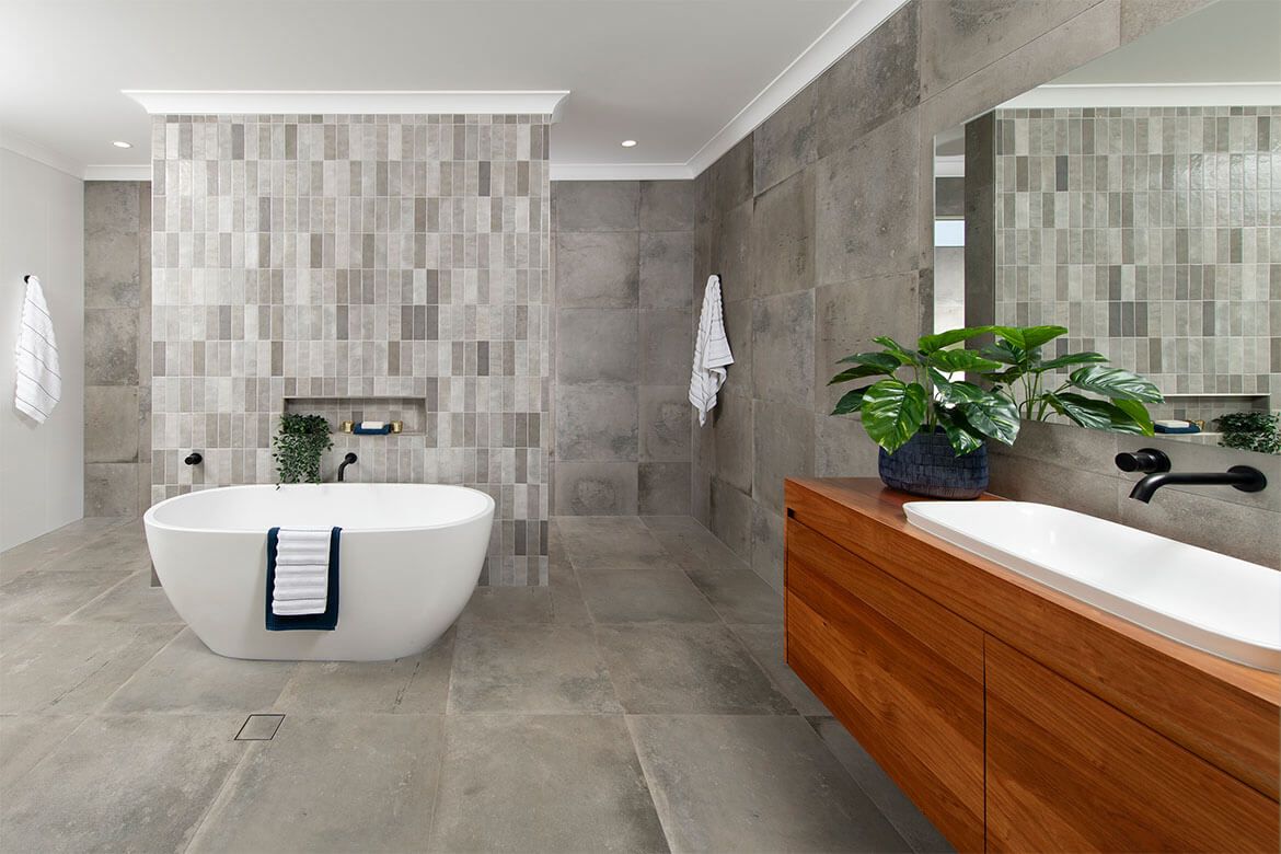 A spacious bathroom featuring a large tub and a stylish sink, creating a relaxing and inviting atmosphere.