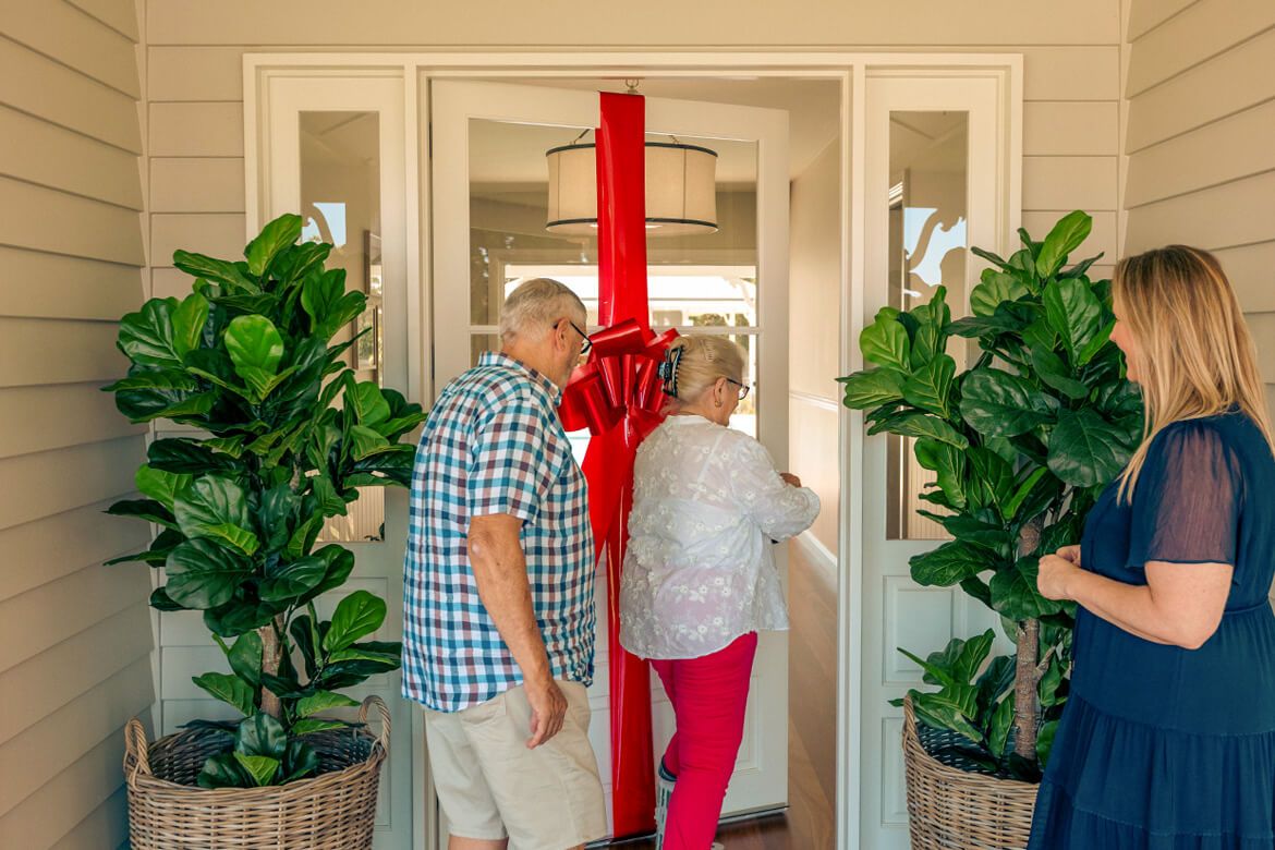 Endeavour Foundation Prize Home 453 winners Sonia and John enter their new home for the first time.