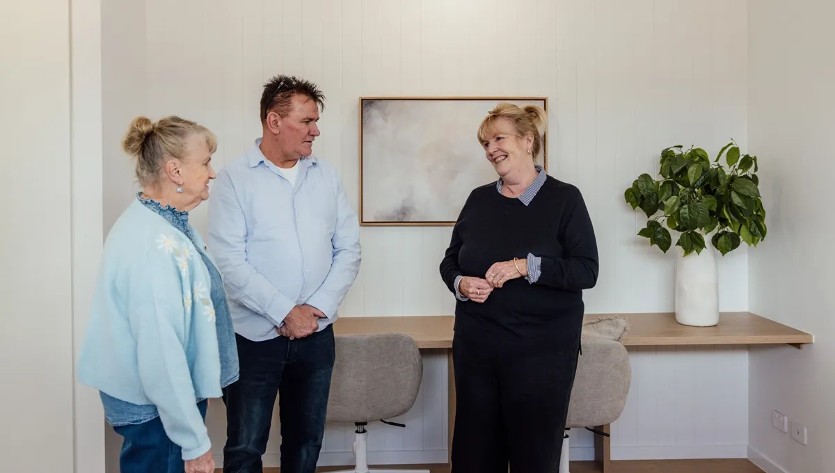 Heather shows Mal and his mum the interior design and features at his Golden Beach Prize Home.